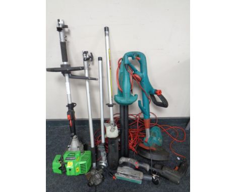 A crate containing a Florabest Petrol garden multi-tool together with a Bosch garden strimmer and hedge trimmer and other pow