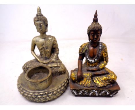 Two contemporary Buddha figures one with tea light holder.
