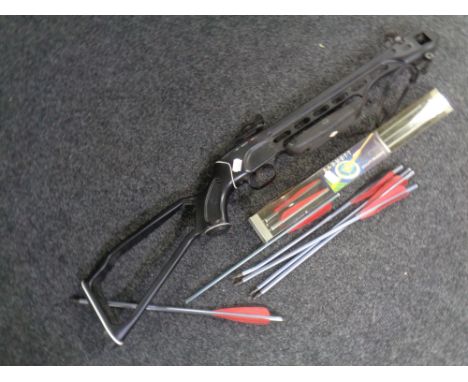 A crossbow together with a quantity of crossbow bolts.