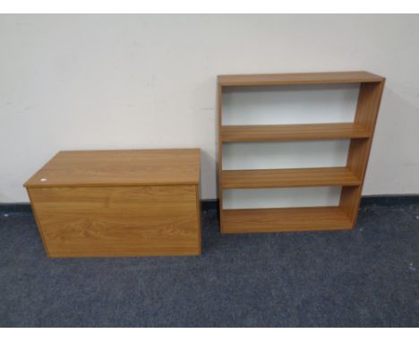 A pine effect shelf and storage cabinet.