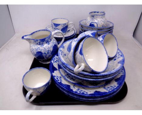 A set of 34 pieces of Poole pottery hand painted blue and white tea and dinnerware.