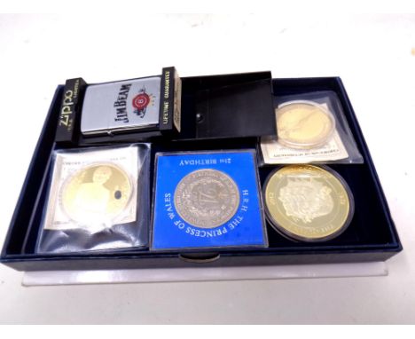 A Jim Beam Zippo lighter (boxed) together with a commemorative crown and three gold plated commemorative coins.