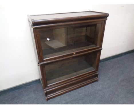 An Edwardian Globe Wernicke two-tier oak stacking bookcase on stand 