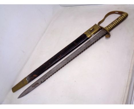 A British 1856 pattern Pioneer's sword bayonet by Wilkinson of London in brass and leather sheath.