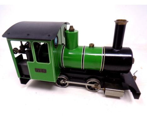 A hand built model steam engine 'Iver' with a Futaba remote handset and box containing track.