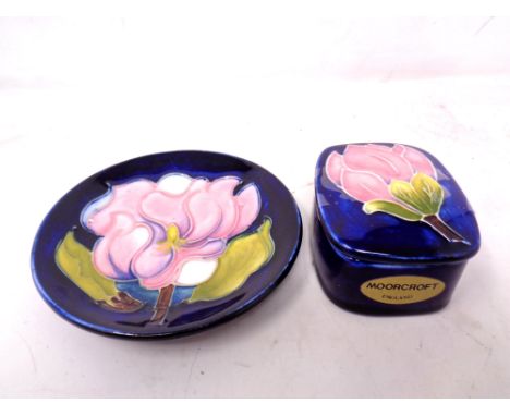 A Moorcroft Magnolia Dish (11cm diameter) together with a lidded trinket pot.
