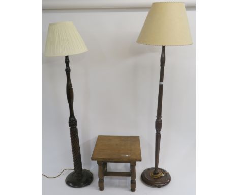 A mahogany standard lamp with barley twist column, an oak standard lamp and a side table (3) Condition Report: Available upon