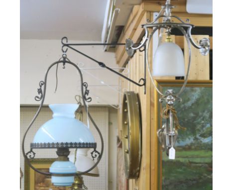A metal hanging oil lamp with blue shade and a corner wall light (2) Condition Report: Available upon request