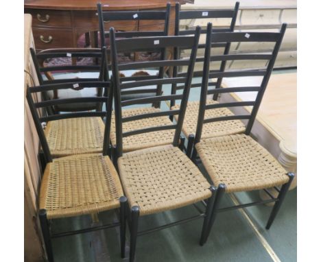 A set of four black ladder back chairs with string seats for Rooksmoor Mills, Stroud and a pair of black ladder back chairs w