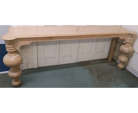 A modern limed pine console table with baluster supports, retailed by Design Works, Interior designers, Glasgow,76cm high x 2