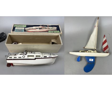 Penguin super scale model Avon 17 inch battery powered boat in original box together with a pond yacht 
