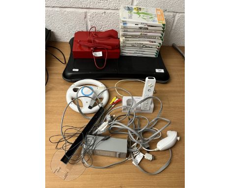 Nintendo Wii games console together with Wii Fit, games and accessories