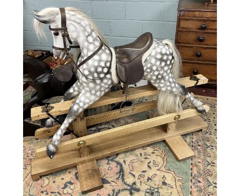 Fine quality rocking horse with leather saddle and real horse hair in excellent condition