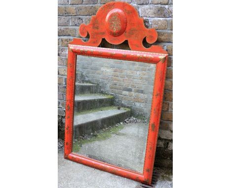 A red-japanned mirror in early 18th century style, decorated with gilt sprigs, the oblong plate within a bolection-moulded fr