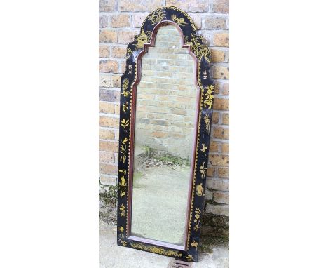 An early 18th century style black-lacquered mirror in a fiat-sprigged arched flat frame&nbsp;