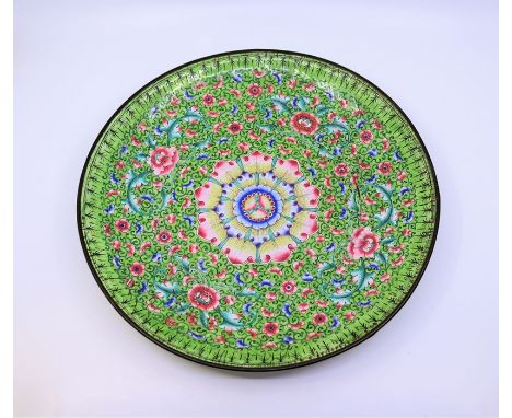 A large Chinese green ground Qing dynasty enamel charger with scrolling lotus flower&nbsp;