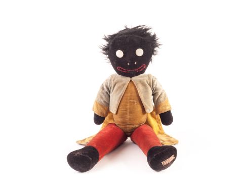 A Chad Valley jointed Golliwog, 1930s, of black, yellow and red velvet with removable blue velvet tailcoat, mohair hair and w