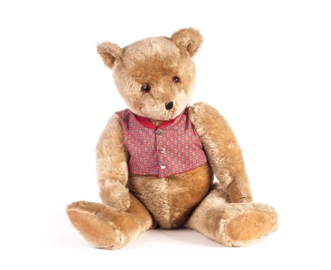 A large Chiltern Hugmee Teddy Bear, 1950s, with dark blonde mohair, orange and black glass eyes, black stitched nose, mouth a