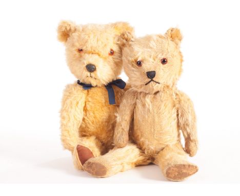 Two post-war Chiltern Hugmee Teddy Bears: on with golden mixed plush, orange and black glass eyes, painted cloth pads, label 