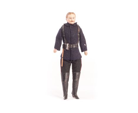 A German bisque shoulder- head dolls’ house fireman, with blonde painted and moulded hair with centre parting, moulded mousta