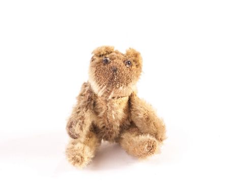 A Farnell ‘soldier’ Teddy Bear, circa 1918, with blonde mohair, clear and black glass eyes, pipe-cleaner ears, swivel head, p