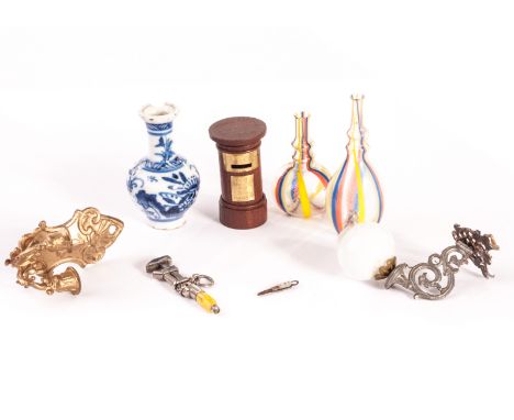 Dolls’ house chattels: a white metal wrench charm - 1 1/2in (4cm) long; a Chinese vase (chip to rim); a soft metal bracket li