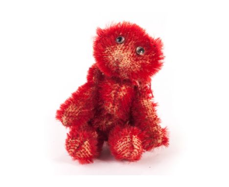 A rare Farnell red mohair ‘soldier’ Teddy Bear, circa 1918, with clear and black glass eyes, pipe-cleaner ears, swivel head, 