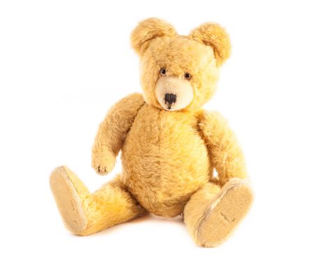 ‘Sunny’, a Diem Teddy Bear, 1950s, with bright yellow mohair, clear and black glass eyes with brown painted backs, inset shor