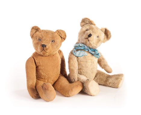 Two French Teddy Bears: a chunky Pintel? with golden mohair, clear and black glass eyes with remains of brown backs, pronounc