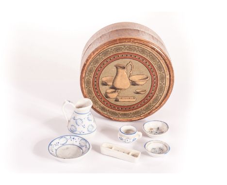 A Dolls’ house wash set, in original box, 1890s, comprising jug and basin and four other pieces in hand painted Onion pattern