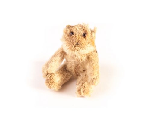 A Farnell ‘soldier’ Teddy Bear, circa 1918, with white mohair, clear and black glass eyes with remains of brown painted backs