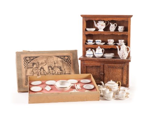 A Continental doll’s dinner service in original box, circa 1900, white with a gilt rim, the box lid with lovely Art Nouveau l