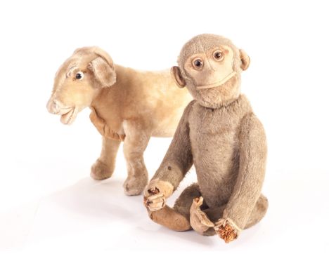 A Schuco yes/no monkey, 1930s, with brown mohair, clear and black glass eyes with brown backs, felt face, ears, hands and fee