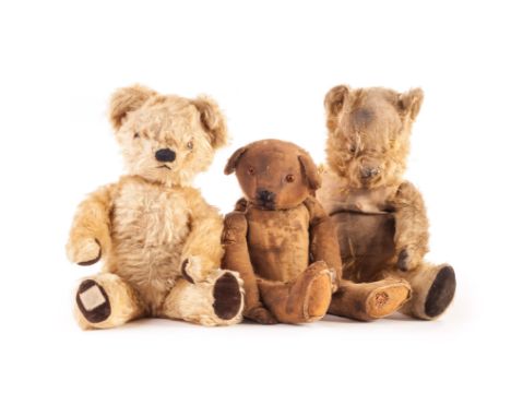 A 1920s British Teddy Bear, with brown mohair, swivel head and jointed limbs with felt pads - 16 1/2in (42cm) high (very worn