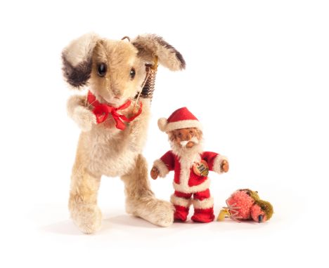 A rare Steiff post-war small Father Christmas/Santa Claus, with rubber face and body, mohair beard, original clothes and card