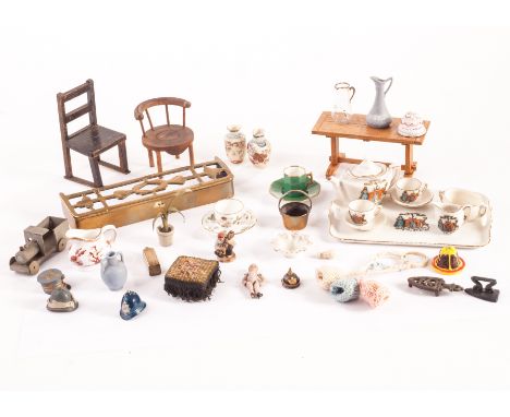 A quantity of dolls’ house items and spares: including a small all-bisque dolls’ house doll; embroidered foot stool; china an