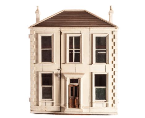 A large carpenter built 19th century dolls’ house, painted white with tiled roof, two chimneys, two storeys and three bays, c