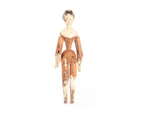 A Grodnerthal jointed wooden dolls’ house doll, with black painted hair falling onto her face, slight yellow painted comb and