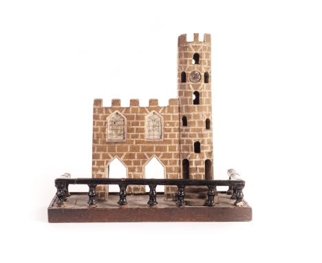 A 19th century carved and painted wood castle, probably the base of an automaton, with two large doorways, windows and crenne