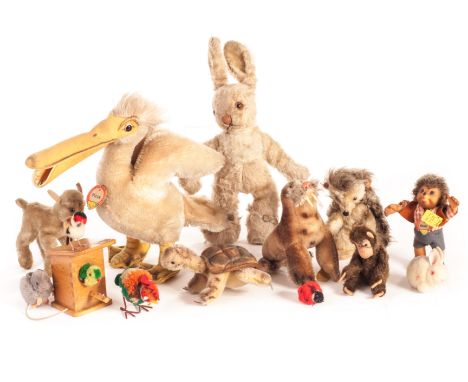 Post-war Steiff animals: comprising a Piccy Pelican with button, yellow cloth tag and chest tag - 9in (23cm) high; a pom-pom 