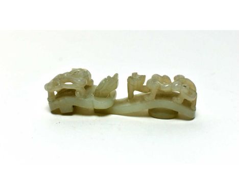 A Chinese pale green jade belt hook, and clasp, probably 19th Century, carved with a dragon head and chilong, 8.5cms. (2)