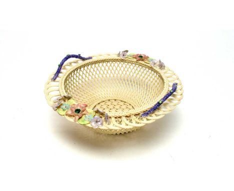 A Belleek lattice and weave basket, with double lilac branch handles, applied with pastel coloured flowers, printed dog and h