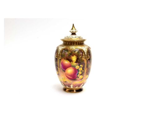 A Royal Worcester fruit painted vase and cover by Brian Leaman, with pierced cover and arcaded panels, painted with peaches a