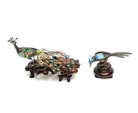 A Chinese silver gilt, enamel and cloisonne jewelled model of a peacock, early 20th Century, fixed to a varnished wooden base
