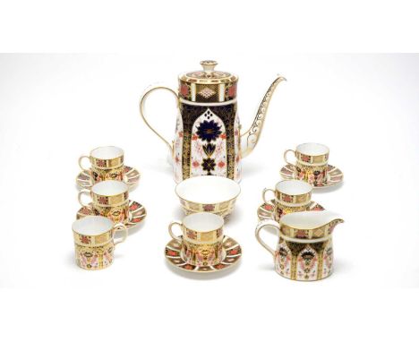 A Royal Crown Derby part Imari design coffee service pattern 1128, comprising: coffee pot and cover, six coffee can, five sau