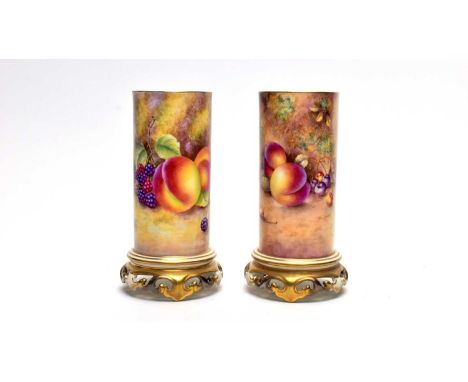 A pair of Royal Worcester fruit painted sleeve vases by Paul English and Brian Leaman, each on pierced gilt scroll bases, pai