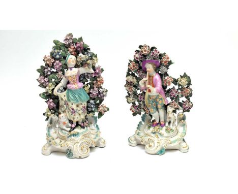 A matched pair of Derby figures of a shepherd and shepherdess, circa 1780. The shepherd depicted playing a flute, the shepher