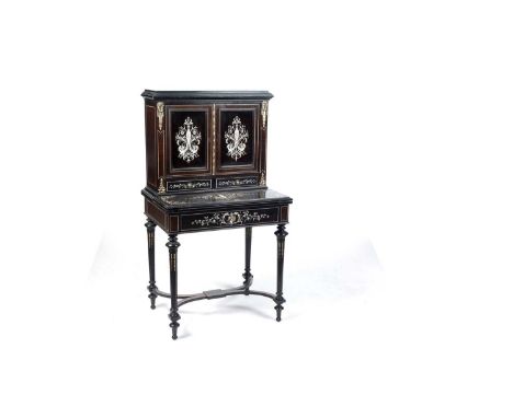 A late 19th Century Italian ebonised and ivory inlaid writing cabinet, in Louis XVI style, the upper section with cupboard do