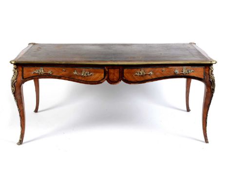 A Louis XVI-style kingwood and coromandel writing desk, the brown leather writing area with tooled edges, encompassed by bras