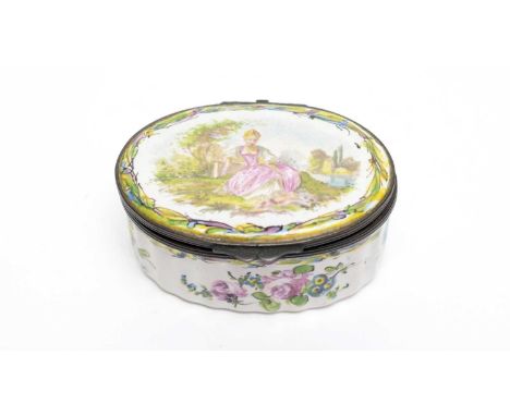 A Lille faience snuff box, 19th century, of oval form, decorated with a figure of a lady seated in a garden, floral spays and